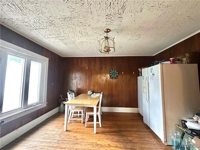 914 S Main St, Shelby, NY 14103 - dining space featuring plenty of natural light, light wood finished floors, and wooden walls