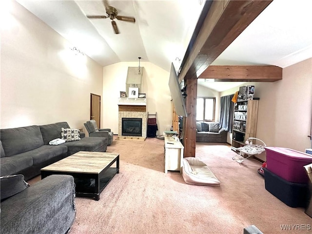 914 S Main St, Shelby, NY 14103 - living room featuring a ceiling fan, carpet floors, vaulted ceiling, and a tile fireplace