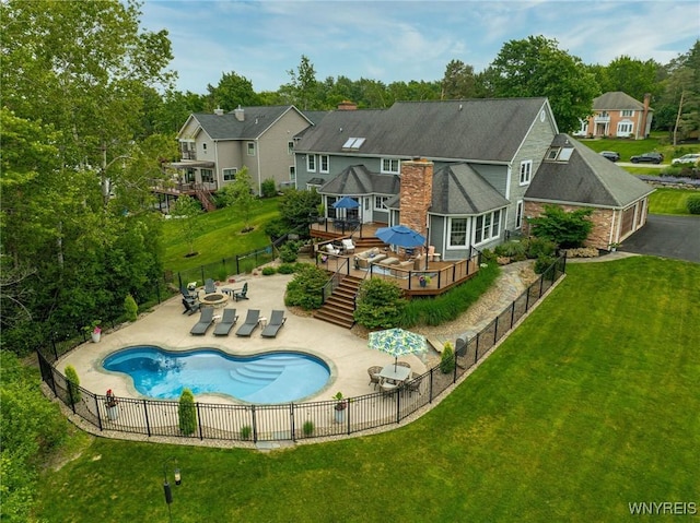 135 Fox Meadow Ln, Orchard Park, NY 14127 - rear view of house featuring a wooden deck, a fenced backyard, a patio area, stairs, and a chimney