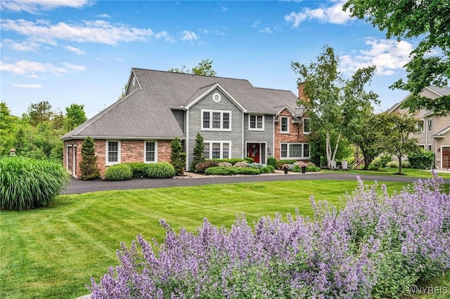 135 Fox Meadow Ln, Orchard Park, NY 14127 - view of front facade featuring a front lawn and a chimney