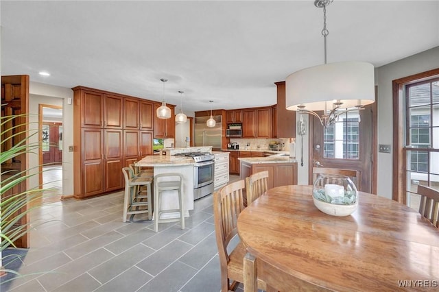 135 Fox Meadow Ln, Orchard Park, NY 14127 - dining space featuring light tile patterned floors and recessed lighting
