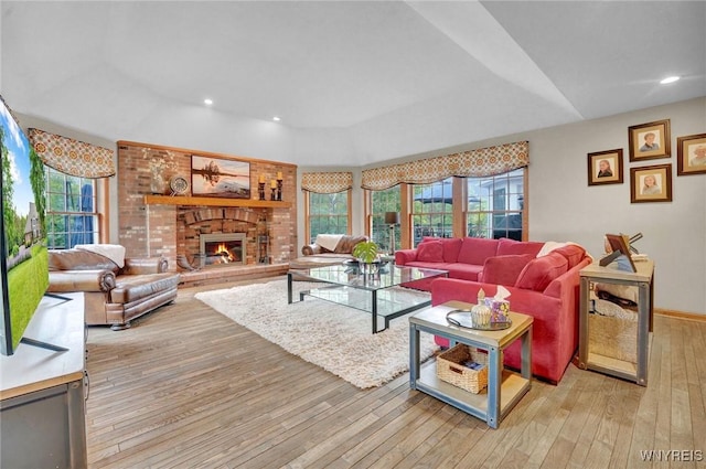 135 Fox Meadow Ln, Orchard Park, NY 14127 - living area featuring light wood-style flooring, a brick fireplace, and recessed lighting
