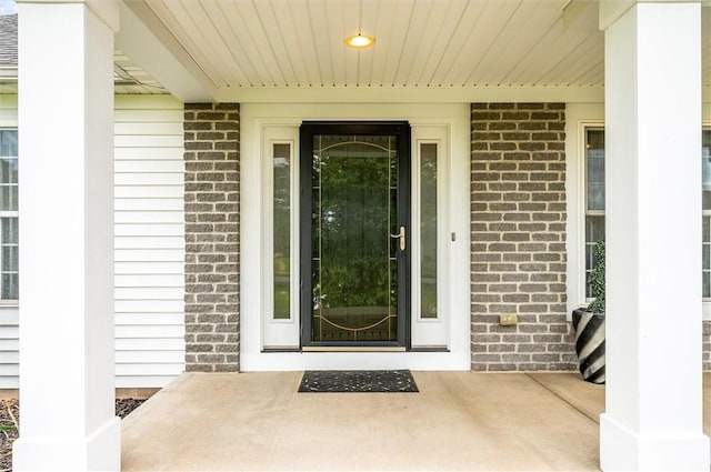8 Brongo Ln, Gates, NY 14559 - property entrance featuring brick siding and covered porch
