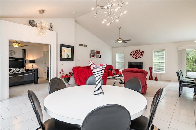 8 Brongo Ln, Gates, NY 14559 - dining room with a chandelier, a ceiling fan, high vaulted ceiling, and light tile patterned floors