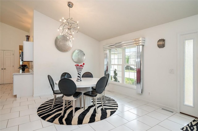 8 Brongo Ln, Gates, NY 14559 - dining room featuring lofted ceiling, light tile patterned flooring, and a chandelier