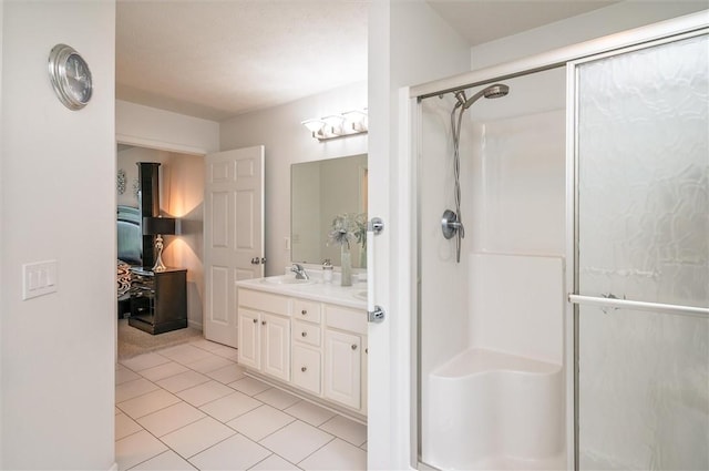8 Brongo Ln, Gates, NY 14559 - full bathroom with a stall shower, double vanity, and tile patterned flooring