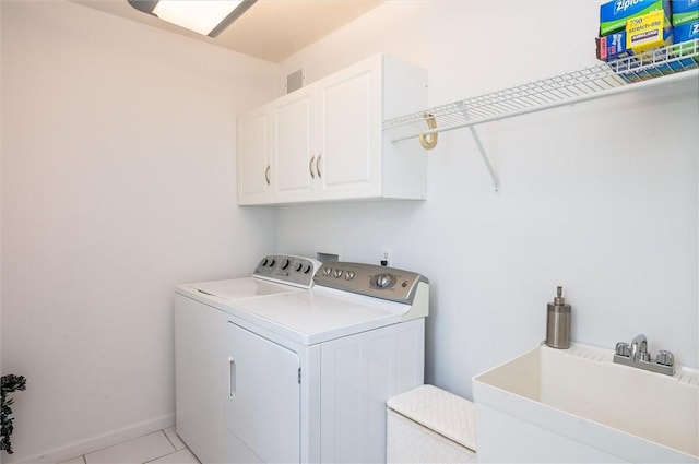 8 Brongo Ln, Gates, NY 14559 - laundry area with washing machine and clothes dryer, cabinet space, and light tile patterned flooring