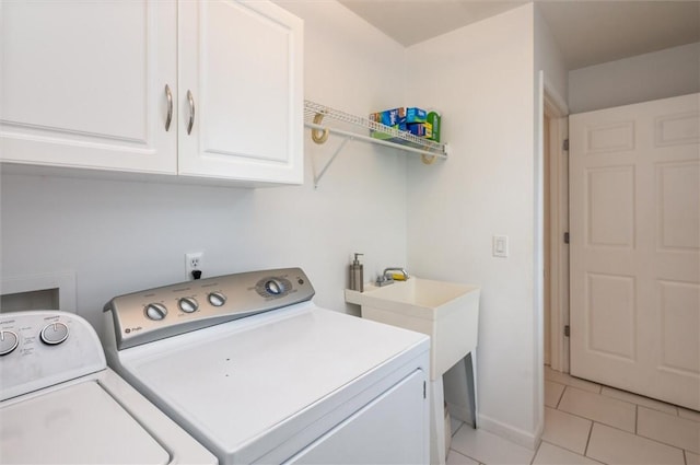 8 Brongo Ln, Gates, NY 14559 - laundry area featuring separate washer and dryer, light tile patterned floors, and cabinet space