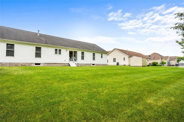 8 Brongo Ln, Gates, NY 14559 - rear view of house with entry steps and a yard