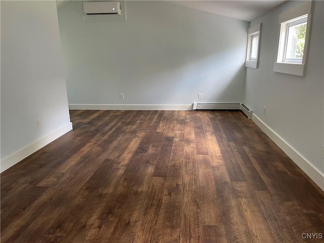 203 E Genesee St, Manlius, NY 13066 - unfurnished room with a baseboard radiator, an AC wall unit, and dark wood finished floors