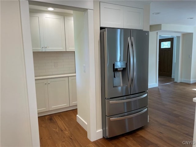 203 E Genesee St, Manlius, NY 13066 - kitchen featuring stainless steel fridge, dark wood-style flooring, decorative backsplash, white cabinets, and recessed lighting