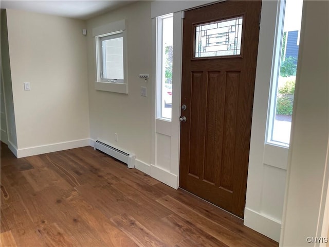 203 E Genesee St, Manlius, NY 13066 - entrance foyer featuring a baseboard radiator, healthy amount of natural light, and dark wood-style flooring