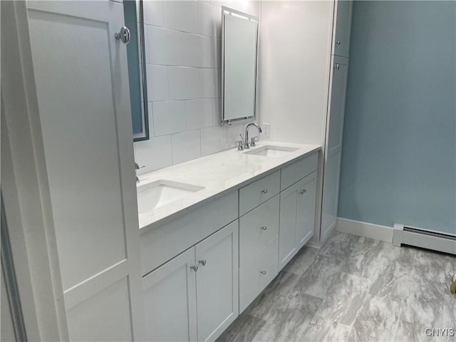 203 E Genesee St, Manlius, NY 13066 - full bathroom featuring a baseboard heating unit, double vanity, marble finish floors, and decorative backsplash