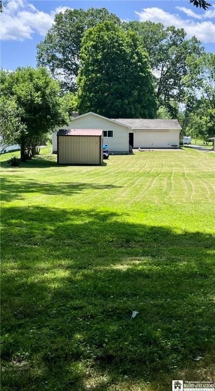 3194 Cranberry Rd, Allegany, NY 14760 - view of green lawn with an outdoor structure