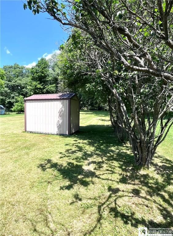 3194 Cranberry Rd, Allegany, NY 14760 - view of green lawn featuring a shed