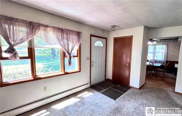 3194 Cranberry Rd, Allegany, NY 14760 - foyer entrance featuring a baseboard heating unit and dark carpet