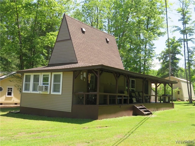 8211 Elmwood Dr, Rushford, NY 14717 - back of property featuring a shingled roof, a yard, cooling unit, and a porch
