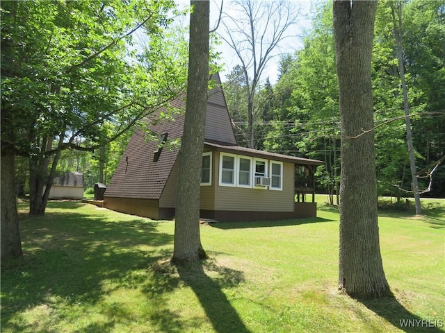 8211 Elmwood Dr, Rushford, NY 14717 - view of property exterior with a lawn and cooling unit