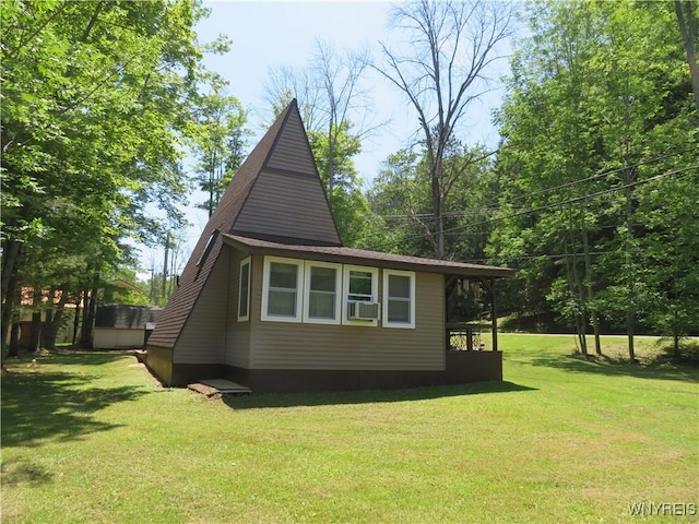 8211 Elmwood Dr, Rushford, NY 14717 - view of side of home featuring a yard and cooling unit