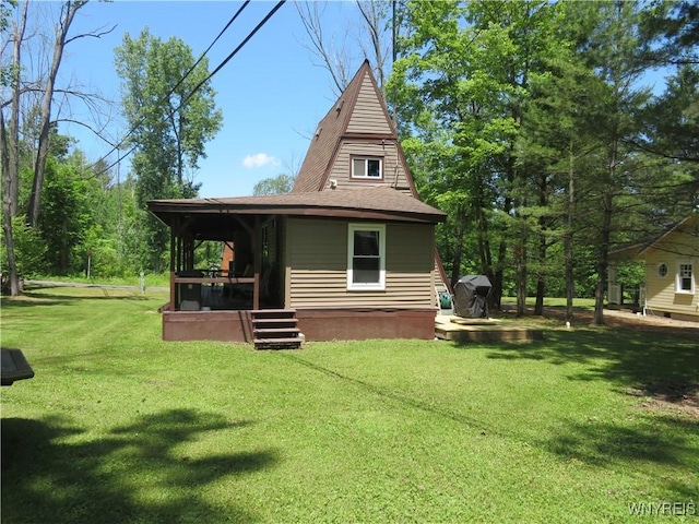 8211 Elmwood Dr, Rushford, NY 14717 - rear view of house featuring a lawn