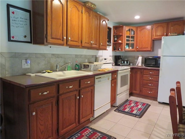 8211 Elmwood Dr, Rushford, NY 14717 - kitchen with white appliances, light tile patterned floors, brown cabinets, backsplash, and open shelves