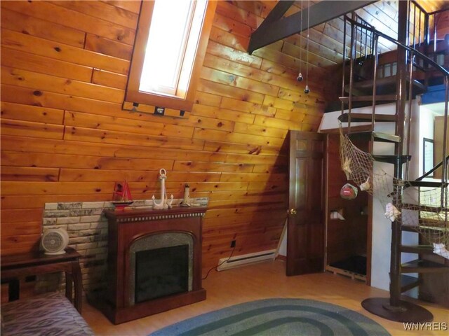 8211 Elmwood Dr, Rushford, NY 14717 - unfurnished living room featuring stairs, healthy amount of natural light, wood finished floors, and a fireplace