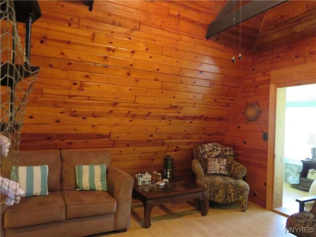 8211 Elmwood Dr, Rushford, NY 14717 - living room featuring wooden walls and wood finished floors