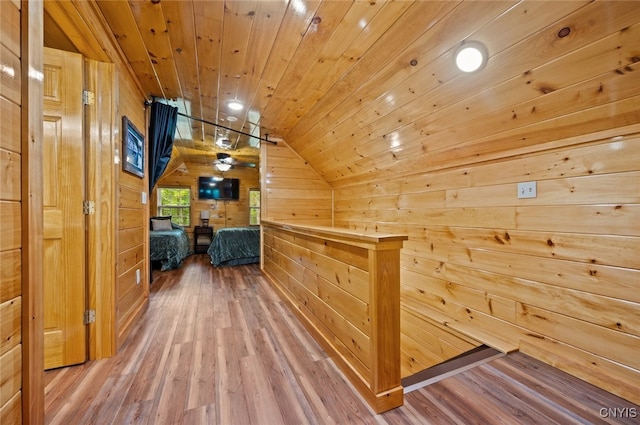 224 Macarthur Rd, Russia, NY 13324 - hall featuring vaulted ceiling, wood finished floors, wood walls, and wood ceiling