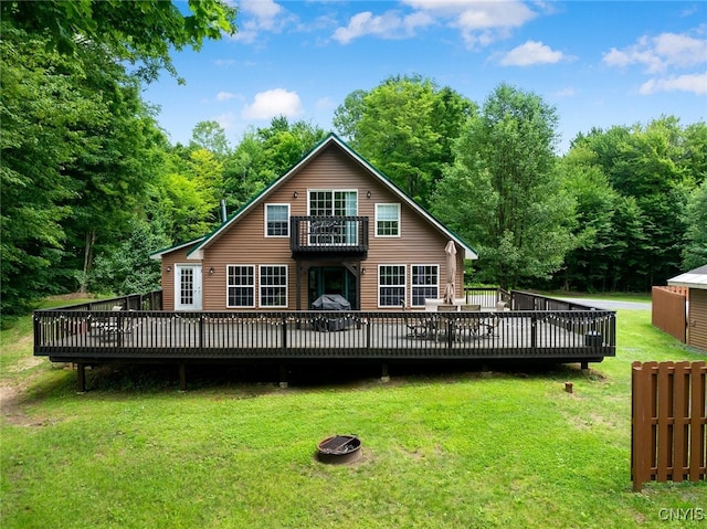 224 Macarthur Rd, Russia, NY 13324 - back of house with a balcony, a lawn, a deck, and a forest view