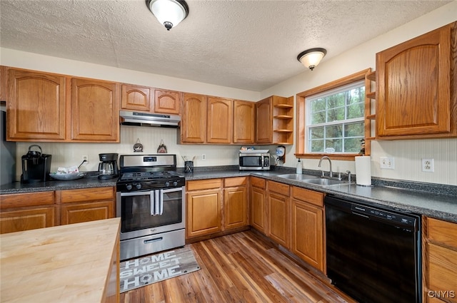 224 Macarthur Rd, Russia, NY 13324 - kitchen with appliances with stainless steel finishes, open shelves, under cabinet range hood, a textured ceiling, and wood finished floors