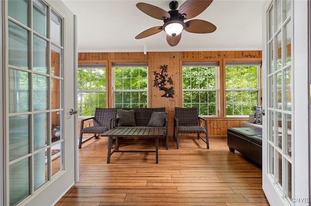 224 Macarthur Rd, Russia, NY 13324 - sunroom / solarium with crown molding, wood walls, hardwood / wood-style floors, and a wooden deck