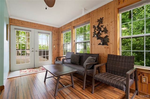 224 Macarthur Rd, Russia, NY 13324 - sunroom featuring french doors, healthy amount of natural light, ornamental molding, wooden walls, and hardwood / wood-style flooring