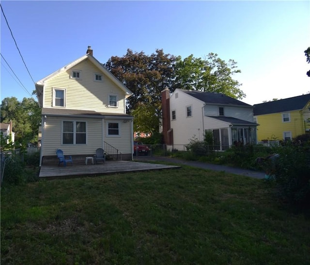 166 Burwell Rd, Irondequoit, NY 14617 - rear view of house featuring a chimney and a deck