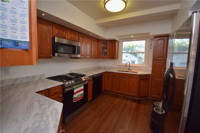 166 Burwell Rd, Irondequoit, NY 14617 - kitchen with stainless steel appliances, brown cabinets, and dark wood-style floors