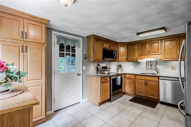 6954 Rome Oriskany Rd, Rome, NY 13440 - kitchen featuring appliances with stainless steel finishes, light tile patterned floors, light stone countertops, and brown cabinets