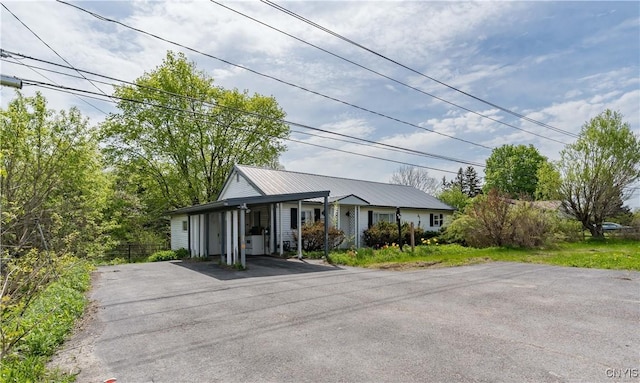 12324 US Route 11, Adams, NY 13606 - single story home featuring asphalt driveway and a metal roof