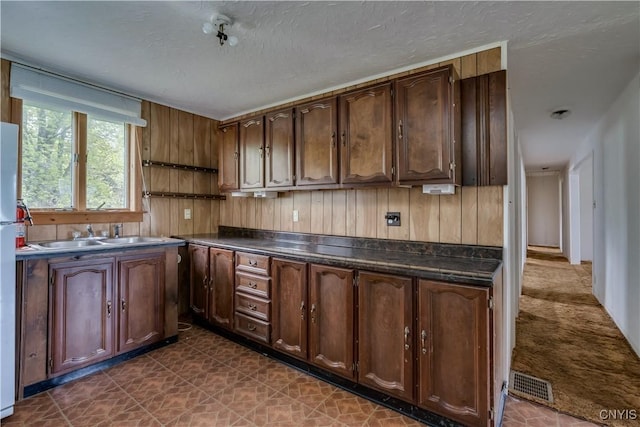 12324 US Route 11, Adams, NY 13606 - kitchen featuring dark countertops and a textured ceiling