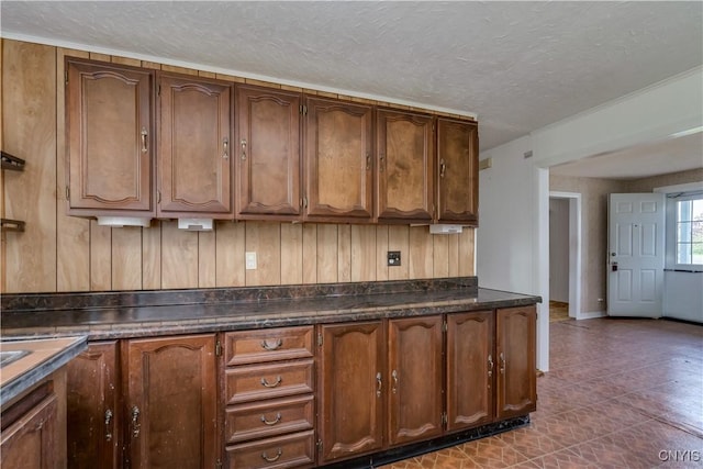 12324 US Route 11, Adams, NY 13606 - kitchen featuring dark countertops, a textured ceiling, and dark tile patterned floors
