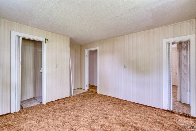 12324 US Route 11, Adams, NY 13606 - unfurnished bedroom with carpet flooring, a closet, and a textured ceiling