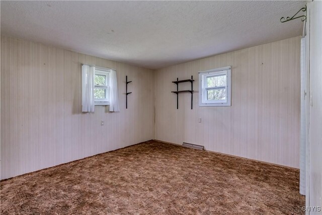 12324 US Route 11, Adams, NY 13606 - empty room with carpet flooring, healthy amount of natural light, and a textured ceiling