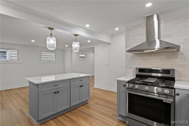 42 Frontenac Ave, Buffalo, NY 14216 - kitchen with stainless steel gas stove, wall chimney range hood, gray cabinets, crown molding, and tasteful backsplash