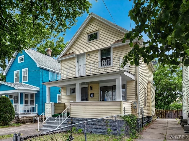 18 Wade Ave, Buffalo, NY 14214 - american foursquare style home with a porch and a fenced front yard