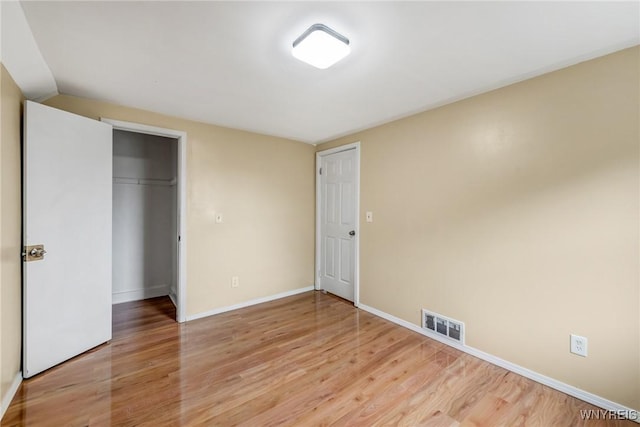 18 Wade Ave, Buffalo, NY 14214 - unfurnished bedroom with light wood-type flooring and a closet