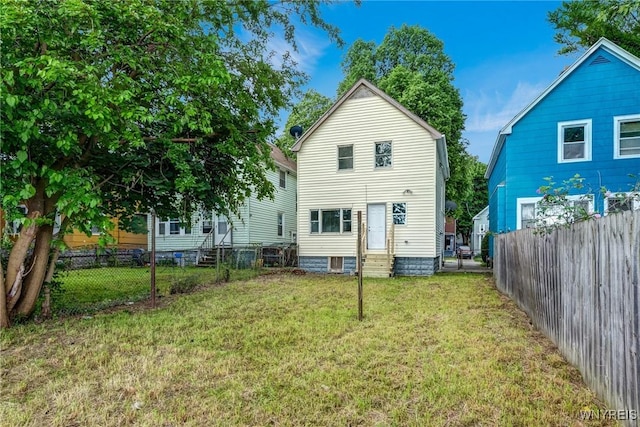 18 Wade Ave, Buffalo, NY 14214 - rear view of property featuring entry steps and a fenced backyard