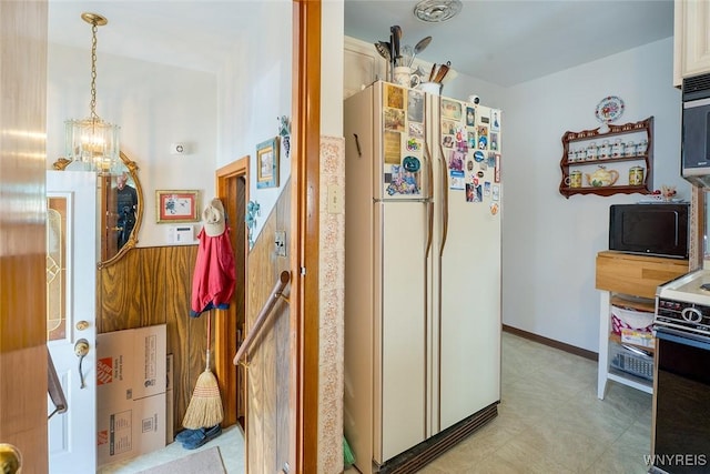 174 Homewood Ave, Tonawanda, NY 14217 - corridor featuring a chandelier and light flooring