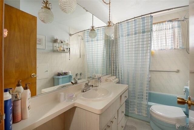 174 Homewood Ave, Tonawanda, NY 14217 - bathroom featuring shower / bath combination with curtain, vanity, and tile walls