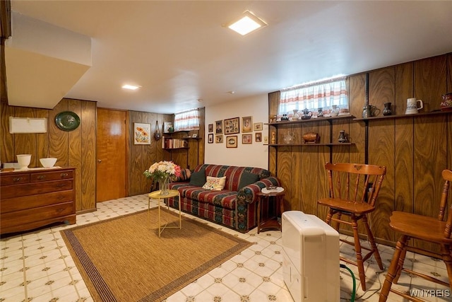 174 Homewood Ave, Tonawanda, NY 14217 - living room with tile patterned floors and wooden walls
