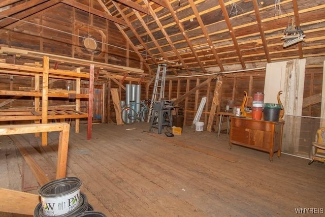 45 S Academy St, Middlebury, NY 14591 - miscellaneous room with wood-type flooring, vaulted ceiling, and water heater