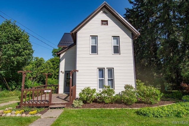 45 S Academy St, Middlebury, NY 14591 - view of front of property featuring a deck, a metal roof, and a front lawn