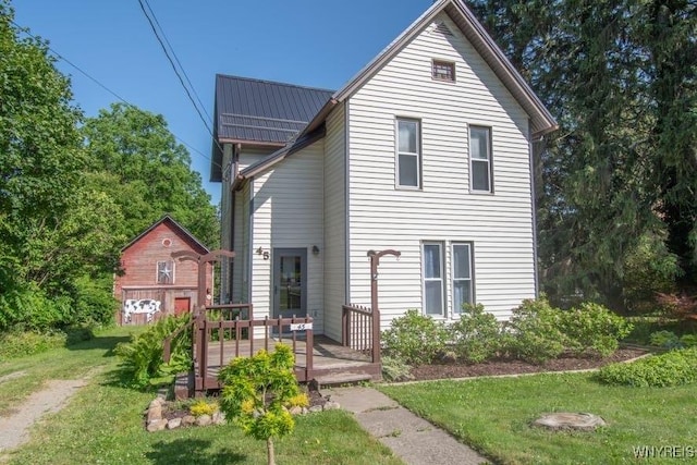 45 S Academy St, Middlebury, NY 14591 - view of front of home featuring a front yard, a metal roof, and a wooden deck